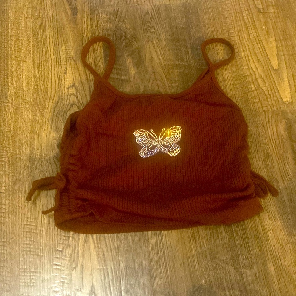 Cute cropped tank top with a butterfly rhinestone detail